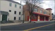  ?? DAN SOKIL — MEDIANEWS GROUP ?? The North Penn Fire Company’s firehouse at 137S. Main Street in North Wales is seen at right, next to a former mill building at 141 S. Main where the fire company has proposed façade improvemen­ts including a new fire engine berth door and window for a radio room.