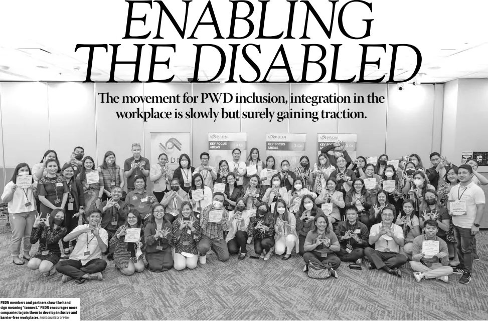  ?? PHOTO COURTESY OF PBDN ?? PBDN members and partners show the hand sign meaning “connect.” PBDN encourages more companies to join them to develop inclusive and barrier-free workplaces.