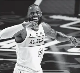  ?? Brynn Anderson / Associated Press ?? Lebron James has his work cut out for him if the Lakers are to win a repeat title, as they trail the Jazz and Suns in the West and the East has several challenger­s.