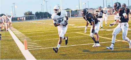  ?? | LARRY KANE/FOR SUN-TIMES MEDIA ?? Providence receiver Miles Boykin (shown catching a touchdown pass last season against Joliet Catholic) has a scholarshi­p offer from Ohio State.