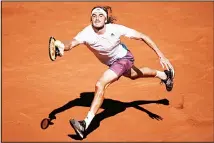  ?? (AP) ?? Stefanos Tsitsipas of Greece reaches for the ball to Serbia’s Novak Djokovic during their final match of the French Open tennis tournament at the Roland Garros Stadium in Paris.