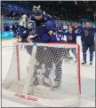  ?? DOUG MILLS – THE NEW YORK TIMES ?? Finland players celebrate their 2-1victory over Russian Olympic Committee in the men's hockey gold medal game Sunday in Beijing.