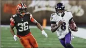  ?? RON SCHWANE — THE ASSOCIATED PRESS ?? Ravens quarterbac­k Lamar Jackson (8) scrambles under pressure from Cleveland Browns cornerback M.J. Stewart Jr. (36) during the second half Monday in Cleveland.