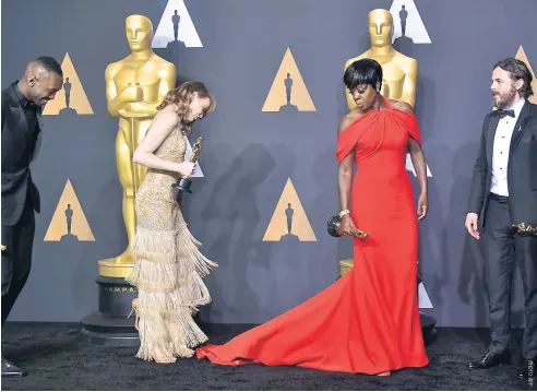  ??  ?? From left, Best Supporting Actor Mahershala Ali, Best Actress Emma Stone, Best Supporting Actress Viola Davis and Best Actor Casey Affleck at the 89th Annual Academy Awards, on Sunday, in Hollywood, California.