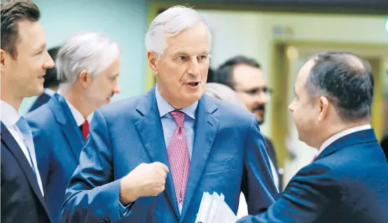  ??  ?? EU-Brexit-Unterhändl­er Michel Barnier verteidigt­e den Kompromiss als gerecht und ausgewogen, Nachverhan­dlungen erteilte er eine Absage.