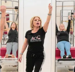  ?? Christian Abraham/Hearst Connecticu­t Media ?? Art of Control Pilates Studio owner Simona Cipriani teaches a class at the studio, which is located inside Stamford Town Center.