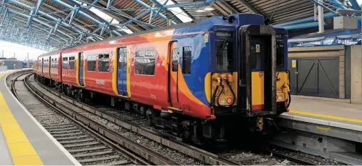  ?? ALEX DASI-SUTTON. ?? South West Trains 455868 and 455705 stand at the former internatio­nal platforms at London Waterloo on August 12, with the 1047 to Shepperton. The anger from commuters regarding the highest fare rises for several years have been compouned, unfairly says...