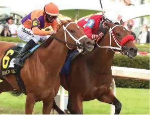  ?? The Sentinel-Record/Richard Rasmussen ?? ■ Jockey Irad Ortiz Jr. and Letruska (3), right, put a head in front of Jockey Florent Geroux and Monomoy Girl (6) at the wire to win the Apple Blossom Handicap Saturday at Oaklawn Racing Casino Resort.