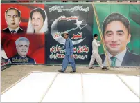  ?? Reuters ?? Supporters of the Pakistan People’s Party install billboards ahead of general elections in Karachi. —