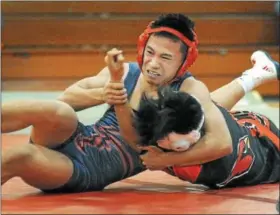  ?? GENE WALSH — DIGITAL FIRST MEDIA ?? Plymouth Whitemarsh’s John Zhang controls Upper Dublin’s Aiden Reed.