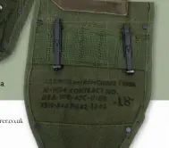  ??  ?? Above: The folding intrenchin­g tool was a small spade that allowed a soldier to quickly dig a shell scrape for protection from enemy fire
Left: Webbing was marked in black ink with contract numbers and NSN stores codes