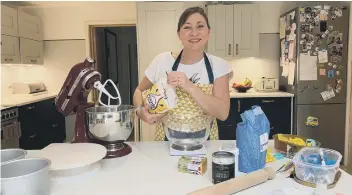  ??  ?? Clare Clark, busy baking in her kitchen