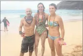  ??  ?? LIGHT AT THE END OF THE CHANNEL: Sarah Ferguson, centre, received a Hawaiian welcome after swimming the Kai’wi Channel. With her are her seconders, blogger John McCarthy and coach Sarah Houston.