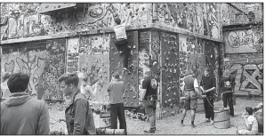  ??  ?? This graffiti-covered Rick Steves’ Europe/RICK STEVES WWII bunker is now the largest climbing wall in the city.