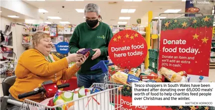  ?? MATTHEW HORWOOD ?? Tesco shoppers in South Wales have been thanked after donating over 65,000 meals’ worth of food to help charities feed people over Christmas and the winter.