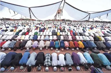  ?? MONEY SHARMA, AFP VIA GETTY IMAGES ?? Muslims pray during the last Friday of the holy fasting month of Ramadan at the Jama Masjid mosque in the old quarters of New Delhi on April 21, 2023.