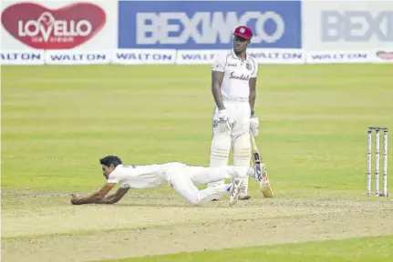  ??  ?? Bangladesh’s Taijul Islam successful­ly takes a catch to dismiss West Indies’ Jermaine Blackwood (not pictured) as Nkrumah Bonner watches.