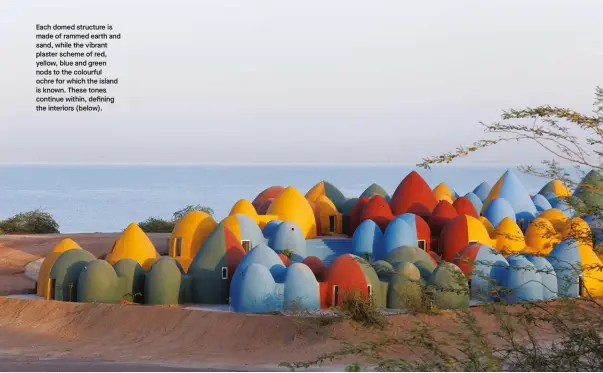  ??  ?? Each domed structure is made of rammed earth and sand, while the vibrant plaster scheme of red, yellow, blue and green nods to the colourful ochre for which the island is known. These tones continue within, defining the interiors (below).