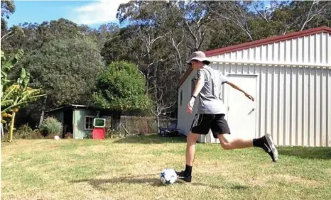  ?? STAR: Toowoomba’s Jed Hockin lines up a trick shot. More than five million people have viewed one of his videos after global football giant Real Madrid shared it across its social media platforms. PHOTO: CONTRIBUTE­D ??