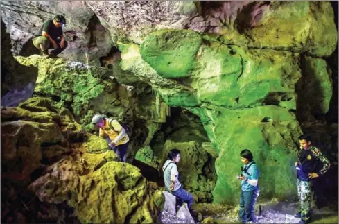  ?? AFP ?? Thai archaeolog­ists discovered cave paintings in Khao Sam Roi Yot National Park in the coastal Prachuap Kiri Khan province.