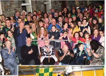  ??  ?? ABOVE: Fans at the Kerry Minor team at the Kerry Minor team victory celebratio­n at Fossa GAA Club, on Monday.