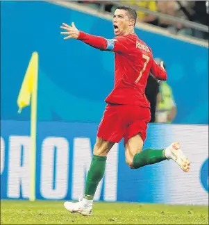  ?? AP PHOTO ?? Portugal’s Cristiano Ronaldo celebrates his side’s equalizing goal during the group B match between Portugal and Spain at the 2018 soccer World Cup in the Fisht Stadium in Sochi, Russia, Friday.