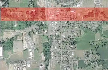  ??  ?? A satellite image shows Sumas, Wash., which is close to the Canadian border near Abbotsford, B.C. The area highlighte­d in red should have been granted to Canada but wasn’t due to a surveyor’s error.