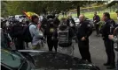  ?? Photograph: Leah Millis/Reuters ?? A police officer speaks to supporters of the Proud Boys on Saturday.