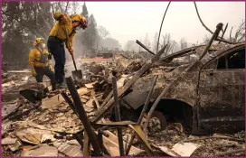  ??  ?? Main image: Oregon resident Derek Trenton salvages some items among the ruins of his parents’ home as wildfires devastate the region