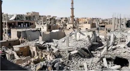  ?? (Reuters) ?? DAMAGED BUILDINGS are pictured during the fighting with Islamic State gunmen in the Old City of Raqqa earlier this month.