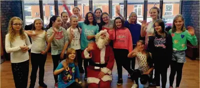  ??  ?? ●●Young performers at NK Theatre Arts get ready to welcome in the Christmas lights switch on