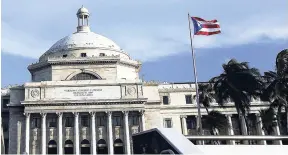  ??  ?? In this July 29, 2015 file photo, a bronze statue of San Juan Bautista stands in front of Puerto Rico’s Capitol in San Juan.