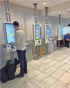  ?? INGRID JACQUES/USA TODAY ?? Self-serve kiosks instead of human cashiers at the McDonald’s in the Minneapoli­s-Saint Paul airport.