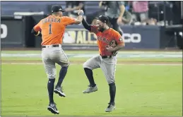  ?? JAE C. HONG — THE ASSOCIATED PRESS ?? Houston’s Carlos Correa (1) celebrates with Jose Altuve after winning Game 6 of the American League Championsh­ip Series on Friday.