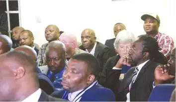  ?? — (Picture by Justin Mutenda) ?? ZANU-PF national commissar Saviour Kasukuwere, Minister Patrick Zhuwao (in glasses), Wonder Mashange (with cap) and Dickson Mfios (centre-back) listen to Professor Jonathan Moyo during the Third Pan African lecture at SAPES Trust in Harare yesterday.