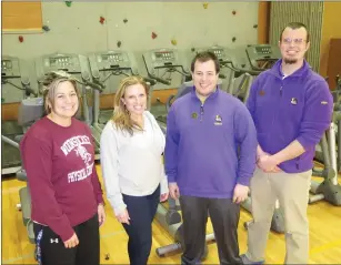  ?? Photos by Joseph B. Nadeau/The Call ?? From left, Woonsocket High School Athletic Director Nancy Giordano, Planet Fitness Woonsocket owner Ann Marie Lukin, Planet Fitness Regional Manager Jason Emmett, and Woonsocket Planet Fitness trainer Josh Maguire stand near the donated workout...