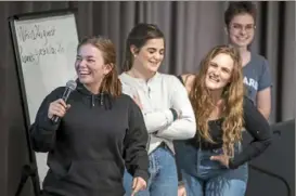  ?? Alexandra Wimley/Post-Gazette ?? From left, Nina Ruffolo of McCandless, Alaina Nypaver of the South Hills, Isabella Mihok of Peters and Abigail Duclos of Mt. Lebanon speak about women in Congress during a GirlGov meeting Thursday at Nova Place.