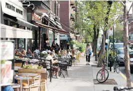  ??  ?? Bernard Ave. is a favourite gathering place in Outremont, since it boasts plenty of shops, cafés and terraces where you can meet friends and enjoy the summer sunshine.