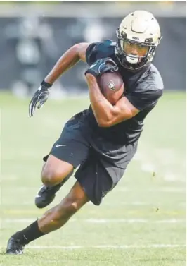  ?? Photos by Cliff Grassmick, Daily Camera ?? Colorado receivers Kabion Ento, left, and Juwann Winfree will have to replace the production of Shay Fields, Bryce Bobo and Devin Ross, each of whom ranks in the top 15 in school history in career catches and receiving yards.