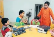  ?? SAMIR JANA/HT ?? Pranab Bar with wife Moumita, daughter Dhriti, and son Lachit at his Basirhat residence in West Bengal’s North 24 Parganas district. They communicat­e among themselves only in Sanskrit.