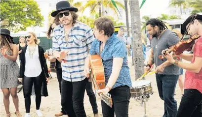  ?? BETH BLACK/STAFF PHOTOGRAPH­ER ?? The band A Thousand Horses went into the crowd for a meet-and-greet with fans during the Tortuga Music Festival in Fort Lauderdale. The members posed for hotographs, signed autographs and gave an impromptu concert.