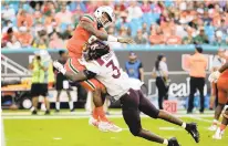  ?? LYNNE SLADKY/
AP FILE ?? Virginia Tech linebacker Alan Tisdale tackles Miami quarterbac­k N’Kosi Perry during the first half Oct. 5, 2019. Tisdale starts at linebacker, but the Hokies don’t have much proven depth at that position.