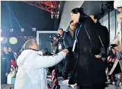  ??  ?? Kim Jong-un’s younger sister Kim Yo-jong, right, attended the Olympic opening ceremony, shaking hands with Moon Jae-in, left, the South’s president