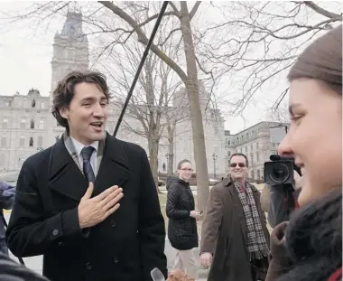  ?? CLÉMENT ALLARD/ THE CANADIAN PRESS ?? Justin Trudeau, newly crowned federal Liberal leader, speaks to the media outside the legislatur­e in Quebec City during a trip to the provincial capital on Thursday. He met with leaders of the Quebec Liberal Party and the Coalition Avenir Québec.