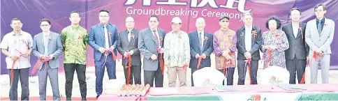  ??  ?? John (fifth right), Great Living Fortune director Mo Wenyu (third left), Sabah Tourism ambassador Shanty Chong (third right) with other guests during the ground breaking ceremony for the first phase of 50 units of villa to be built at Sipadan Mangrove...