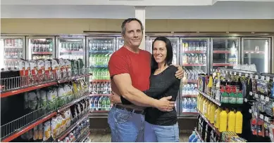  ?? BY CHRIS GREEN ?? John and Melissa James are happy to greet new customers at the reopened F.T. Valley Gas and Grocery on Route 231 south of Sperryvill­e