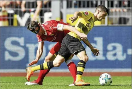  ?? MARTIN MEISSNER — THE ASSOCIATED PRESS ?? Dortmund’s Christian Pulisic, right, battles Stuttgart’s Christian Gentner during a match April called into the U.S. national team when it visits Chester for a friendly with Bolivia May 28. 8. Pulisic will likely be