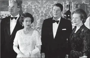  ?? The Associated Press ?? 1984: This June 10, 1984, file photo shows Britain’s Queen Elizabeth II, second left, standing with, West German Chancellor Helmut Kohl, left, U.S. President Ronald Reagan, second right, and Britain’s Prime Minister Margaret Thatcher at London’s...