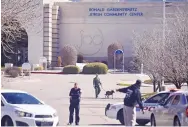  ?? ROBERTO E. ROSALES/JOURNAL ?? Albuquerqu­e police officers cleared the Jewish Community Center of Greater Albuquerqu­e following a bomb scare there Monday morning. The Albuquerqu­e center is one of many that have received bomb threats in recent weeks.