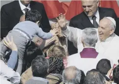  ??  ?? 0 The Pope greets a youngster after leading the Easter Mass